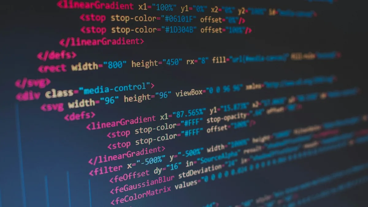Editor showing SVG markup with linear gradients and filters — lightweight, scalable image code